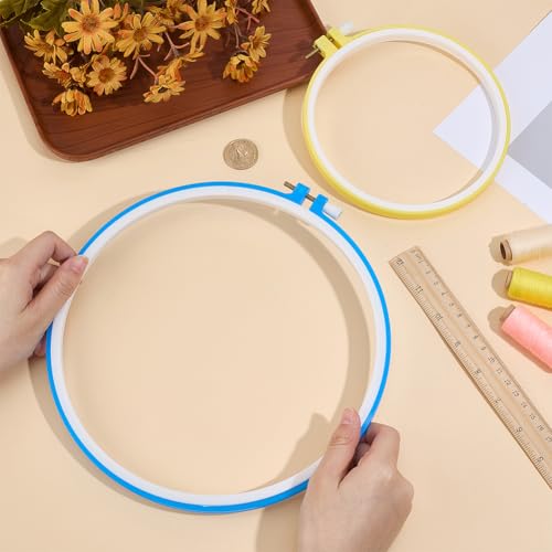 Image of GORGECRAFT 2 Sizes Spring Tension Embroidery Hoop Cross Stitch Tension Hoop Blue Yellow Round Plastic Frame Darning Shed Rings for Embroidery Cross Stitch Sewing DIY Projects (5.6in, 8.23 x 8.9in)