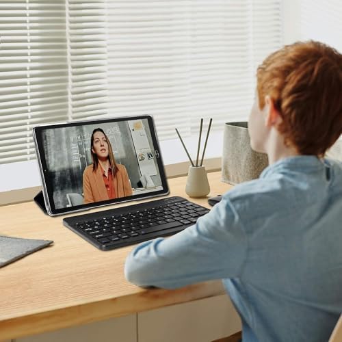 A person using the GOODTEL G2 Tablet with an external Bluetooth keyboard, positioned on a desk.