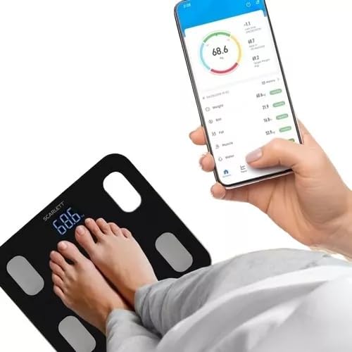 Person's feet on the scale and a smartphone displaying the health tracking app.