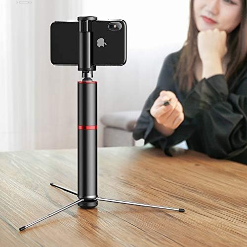 The Baseus selfie stick in tripod mode on a wooden table, with a smartphone mounted.