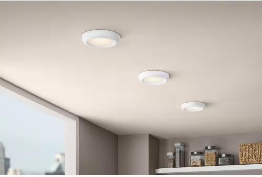 Three installed Commercial Electric flush mount LED lights on a ceiling
