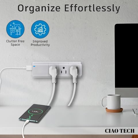 Image showing the outlet extender plugged into a wall, with a phone charging and a laptop nearby, illustrating a clutter-free space.