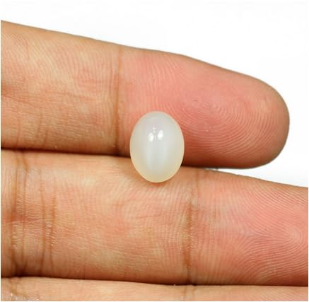 6-carat Chandrakant Mani set in silver ring worn on little finger as per Vedic guidance