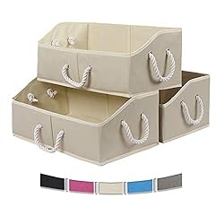 3 stacked open tan storage bins with white rope handles.