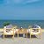 SAFAVIEH Outdoor Nunzio Natural and Beige 4-Piece Patio Set (Pillows Included)