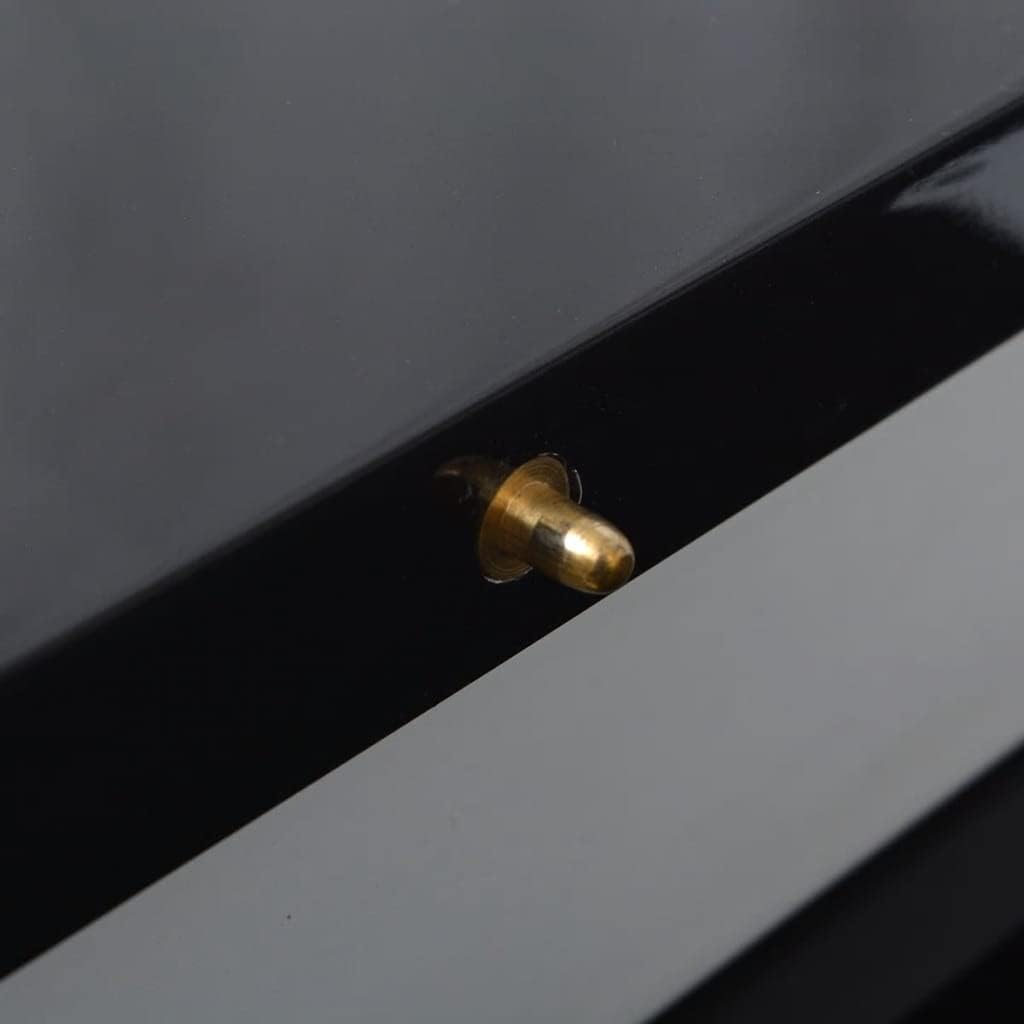 Close-up of a brass-colored alignment pin on the table surface.