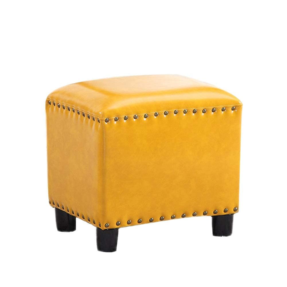 Repose-pieds en cuir jaune pour soulager les jambes lourdes au salon