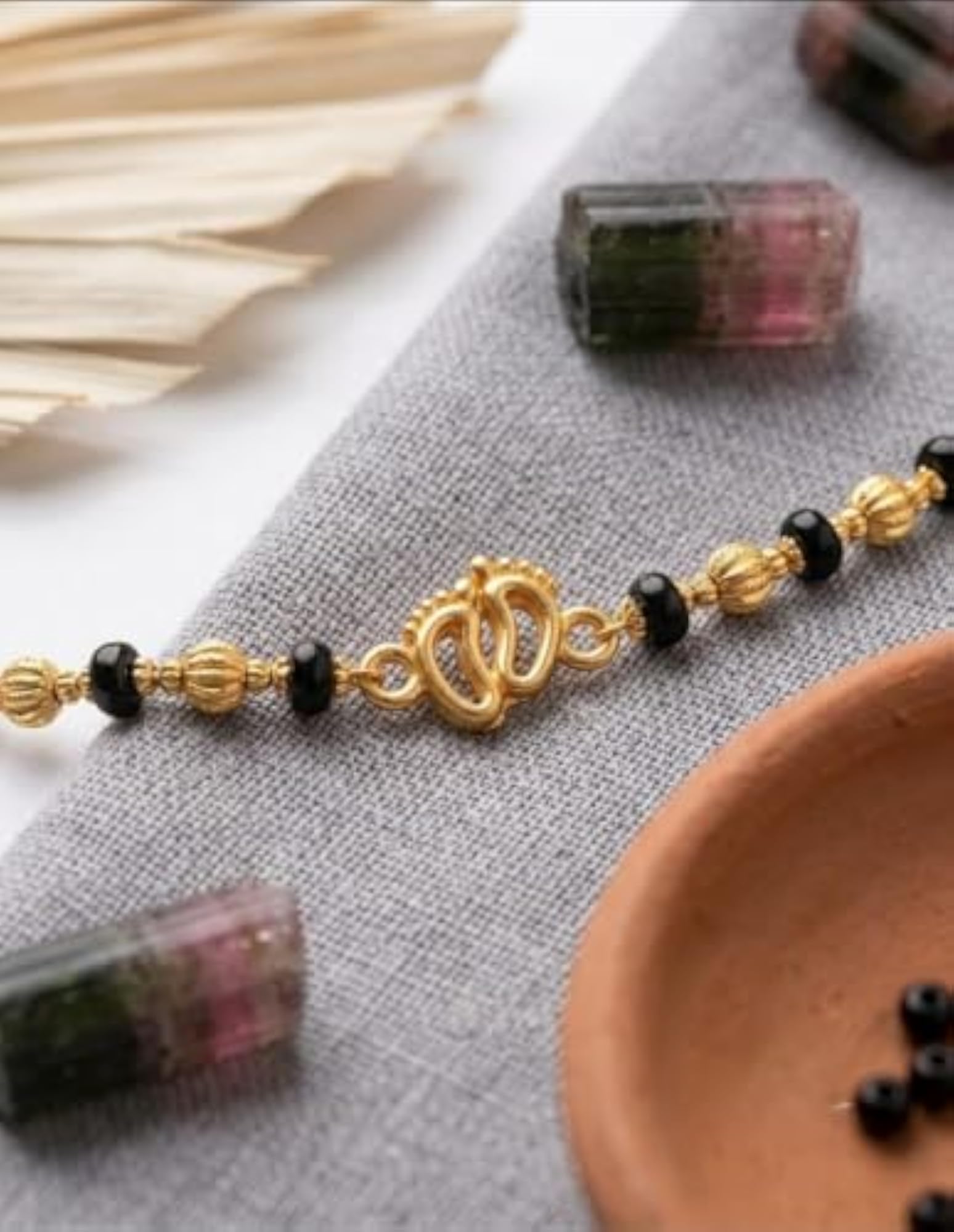 Born Gold-Toned Bead Nazariya with Unique Charm