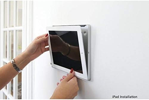 Hands inserting an iPad into the Basalte Eve Tablet Wall Mount