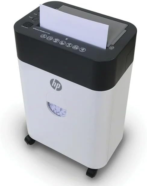 Apa view of the HP AF1009 Micro Cut Paper Shredder, showing the transparent window on the wastebasket filled with shredded paper.