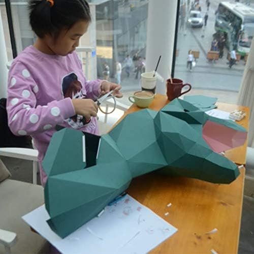 Child applying adhesive to papercraft