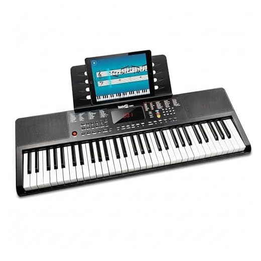 RockJam Teclado compacto de 61 teclas con soporte para partituras, fuente de alimentación, pegatinas para notas de piano y lecciones sencillas de piano, color negro