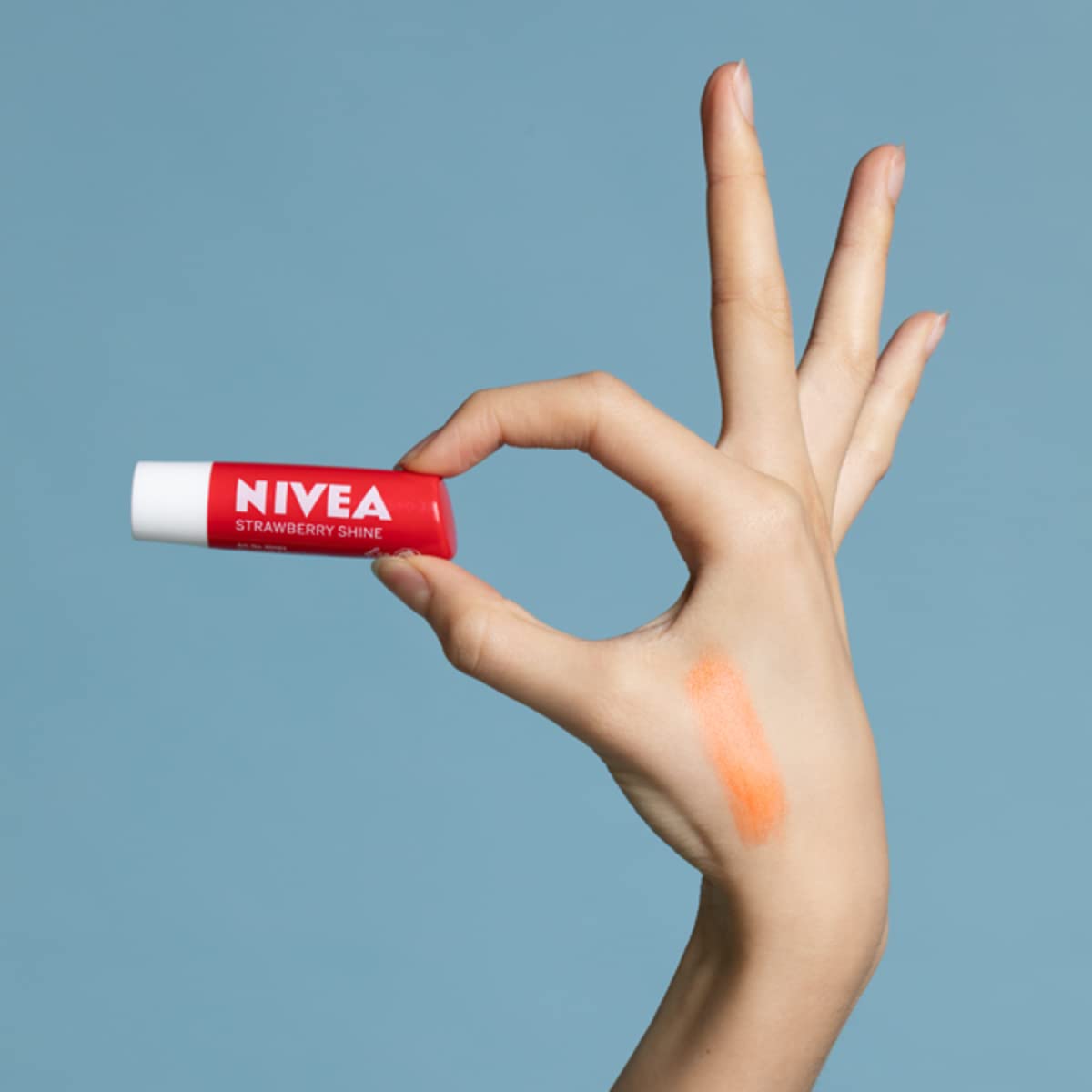 NIVEA Lip Balm Fruity Shine Strawberry (4.8g, Pack of 12), Moisturising Lip Balm Enriched with Natural Oils - Image 4