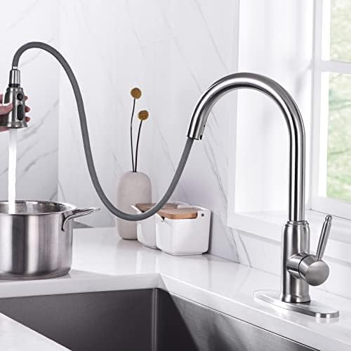 WOWOW kitchen faucet with the pull-down sprayer extended for flexible use.
