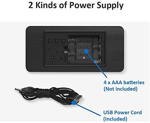 Hand reaching to tap a wooden clock with time and temperature displayed