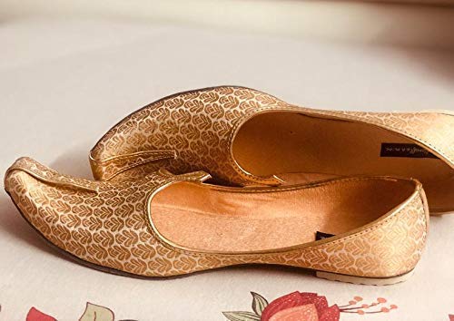 white and gold flats