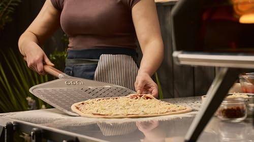 Image of ooni 12 inch Signature Perforated Pizza Peel - Anodised Aluminum Metal Pizza Peel 12 Inch With Long Walnut Wood Handle, Pizza Spatula Paddle, Pizza Oven Accessories, Pizza Tools