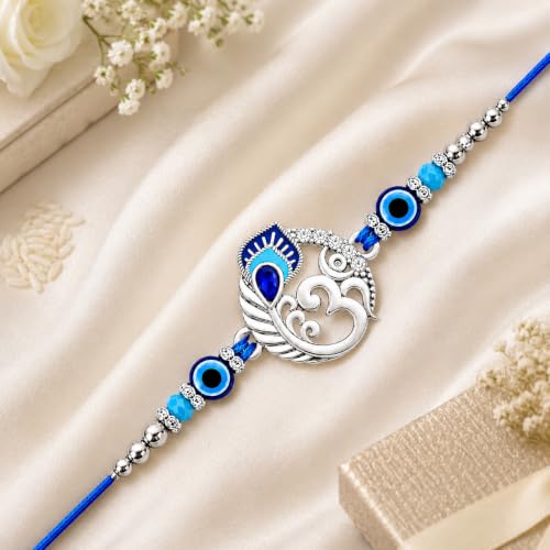 Image of Riddhika Ventures Religious Meenakari Om and Peacock Feather Rakhi With Roli Chawal And Greeting Card