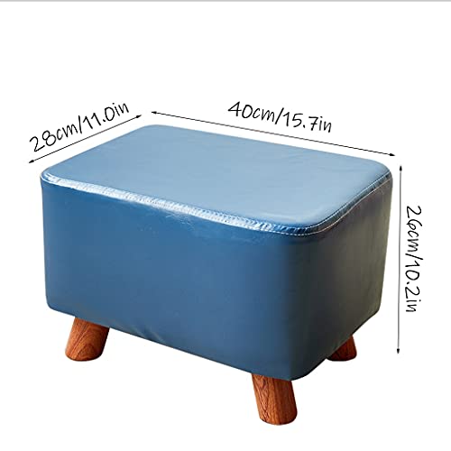 Repose-pieds en cuir noir compact pour optimiser l'espace du salon