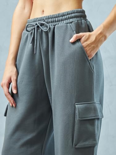 Image of Bewakoof Women's Fleece Super Loose Fit Joggers|Bewakoof Heavy Duty 1.0 | Track pants for woman | Lower for women | Multipurpose | Activewear | Utility Pockets | Lightweight & Flexible Elastic Waist | Casual Joggers | Loose Fit