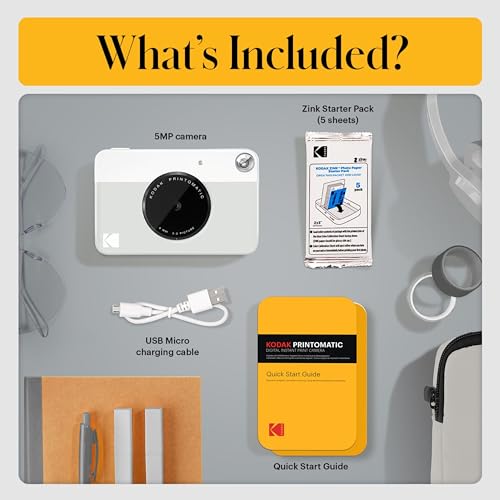 Image of Kodak Printomatic Instant Camera (Grey) Gift Bundle + Zink Paper (20 Sheets) + Deluxe Case + 7 Fun Sticker Sets + Twin Tip Markers + Photo Album + Hanging Frames + Comfortable Neck Strap