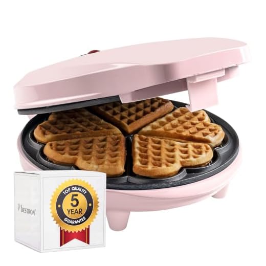 Bestron Wafelijzer voor klassieke hartwafels, Wafelmaker voor wafels in hartvorm, met indicatielampje & antiaanbaklaag, retro-design, 700 Watt, kleur: roze