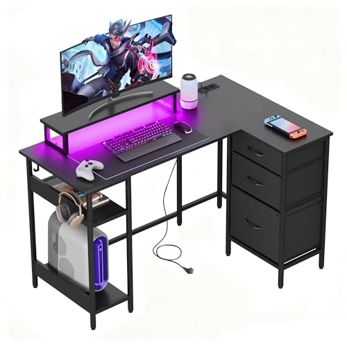DEVAISE Bureau d'angle Gaming en Forme de L avec 3 Tiroirs et Prise Intégrée, 120cm Bureau en L Noir Moderne, Table Informatique Spacieuse pour Setup Gamer, Noir