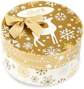 Lindt Schokolade | Goldstücke Pralinés Rundschachtel | 140g | köstliche Schokoladenkugeln in den Sorten Bratapfel, Walnuss, Zimt & Koriander | Pralinen-Geschenk zu Weihnachten