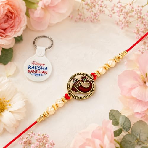 Image of Riddhika Ventures Alluring Gold Plated Floral and Pearl Rakhi (Bracelet) with Roli Chawal, Greeting Card and One Motivational Keychain