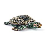 Handverlesene Schmuckschatulle mit Schmucksteinen, die im Licht funkeln.