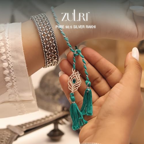 Image of 92.5 Sterling Silver Peacock Feather with Stone Thread Rakhi For Rakshabandhan | Rakhi With Fragrance Greeting Card & Roli Chawal and Silver Certificate of Authenticity