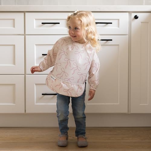 Image of Tiny Twinkle Long Sleeve Bib for Babies & Toddlers | Waterproof Smock Bib for Eating | Machine Washable & Mess-Proof Feeding Essentials | Newborn Shower Gift (Bows, Small 6-24 Months)