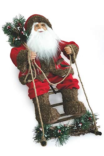 Père Noël avec luge rouge sous le sapin pour magie de Noel