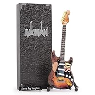 EXPERIENCE OUR RANGE OF GUITARS ON A SMALL SCALE: Experience the magic of his guitar on a smaller scale with our collection of miniature guitars, each one a tribute to the legends who played them. CRAFTED WITH PRECISION: This 10in/25cm wooden Miniatu...