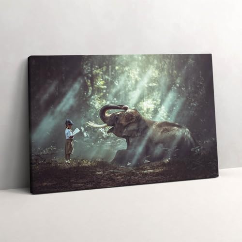Photo sur Toile Un garçon avec un livre pour créer un coin lecture cosy