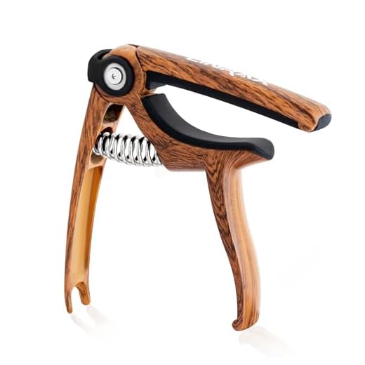 Linrax C4 Cejilla Guitarra, 4 en 1 Capo de Guitarra Extractor de Clavijas Soporte de Púas Cortador de Cuerdas, Cejilla para Guitarra Acústica Eléctrica Bajo Ukelele Banjo Mandolina, Grano de Madera