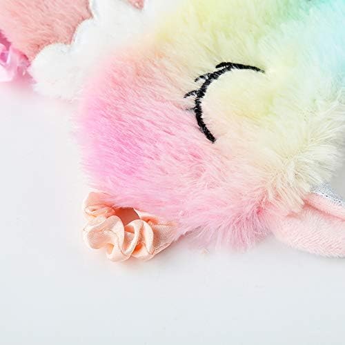 Close-up of a rainbow unicorn sleeping mask, detailing its soft plush texture and elastic strap.