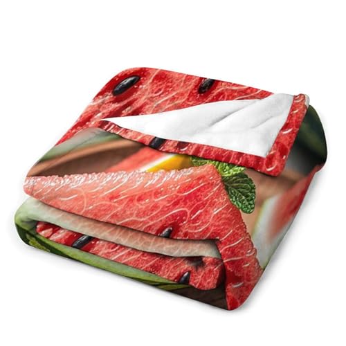 Couverture en micro polaire légère pastèque et citron pour vos soirées canapé