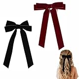 Nœuds de Noël en velours luxueux : expérimentez la touche de luxe. Nos pinces à cheveux sont finies avec des nœuds en velours brillants de qualité supérieure dans un rouge vin profond et festif. Cette matière élégante et sa couleur riche capture l'essence de la saison et donne à vos styles de cheveux festifs un charme raffiné et tangible pour toute fête de Noël.