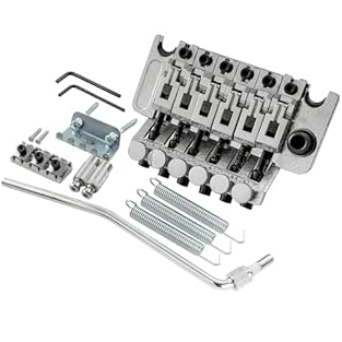 Fits electric guitar Made of zinc alloy String spacing: 10.5x5=52.5mm(2-1/16 inch); post spacing: 74mm(2-29/32 inch); nut width: 42mm(1-21/32 inch) 34mm tall block, with 6mm collared thread trem arm Package included: 1 pc Locking Tremolos Bridge