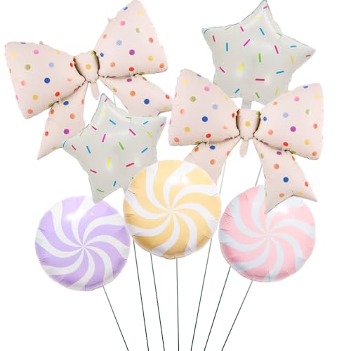 Ballons nœud à pois pastel et étoiles pour émerveiller l'anniversaire d'une fille
