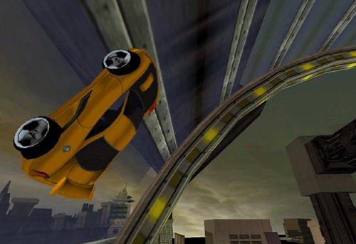 Gameplay screenshot of a yellow Hot Wheels car driving upside down on a loop track in a city environment.