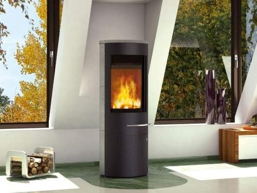 Olsberg TACORA Compact wood stove with grey stone-like side panels in a living room setting.