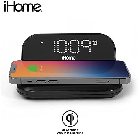 iHome Alarm Clock with a smartphone wirelessly charging, showing Qi Certified logo