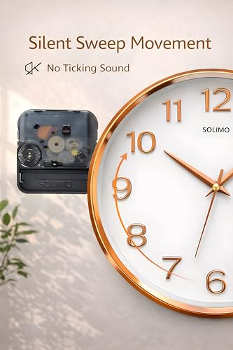 Image of Amazon Brand - Solimo 12 Inches Silent Wall Clock for Living Room Bedroom Office Plastic Easy to Read 3D Numbers Modern Stylish Sweep Movement Wall Clock for Home 1603DX (Rose Gold)