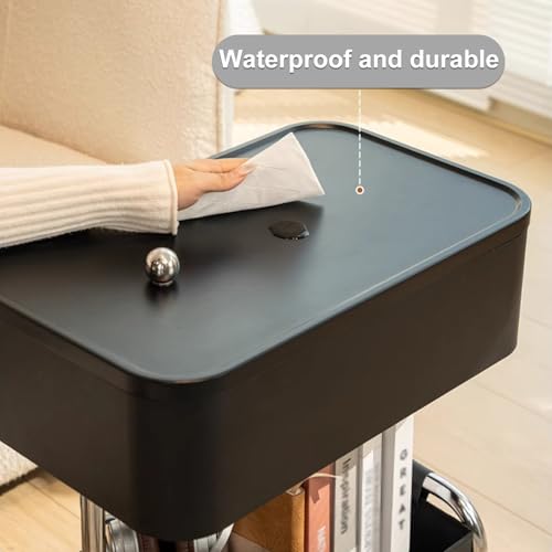 Table d'appoint moderne noire à roulettes pour optimiser les petits salons