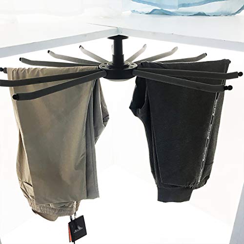 Cintre à pantalons rotatif anti-pli pour optimiser un petit meuble