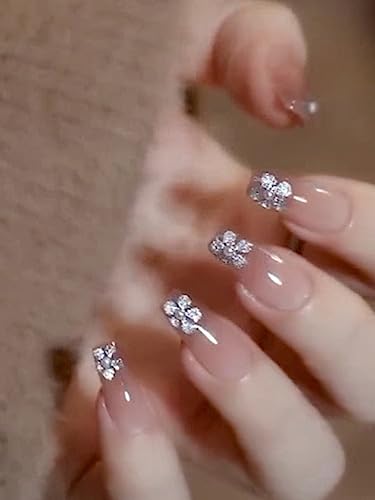 Image of Secret Lives fake artifical acrylic press on nails transparent & brown color false nails extension with silver glitter flower design & 3D white pearls design 24 pieces set with glue sheet stickers