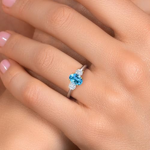Gem Stone King 925 Silver and 10K Yellow Gold Swiss Blue Topaz and White Moissanite 3-Stone Engagement Ring For Women | 1.32 Cttw | Oval 7X5MM and Round 3.5MM | Available in Size 5,6,7,8,94