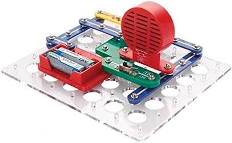 Close-up of a basic circuit assembled on the STEREN K-800 kit baseboard, showing battery module and speaker